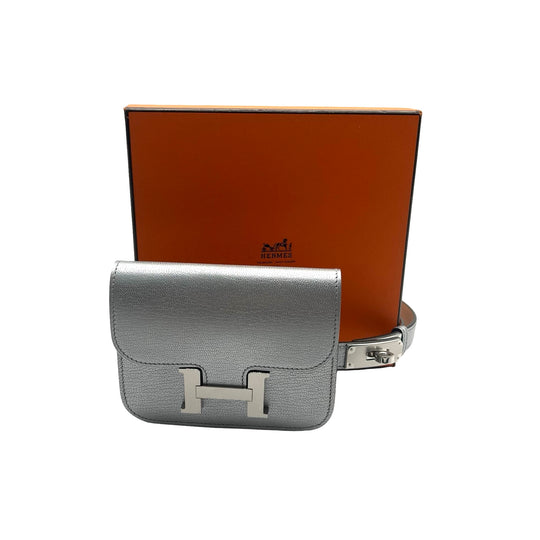 Cinturón Hermès Kelly 18 y Cartera Constance Slim Argent